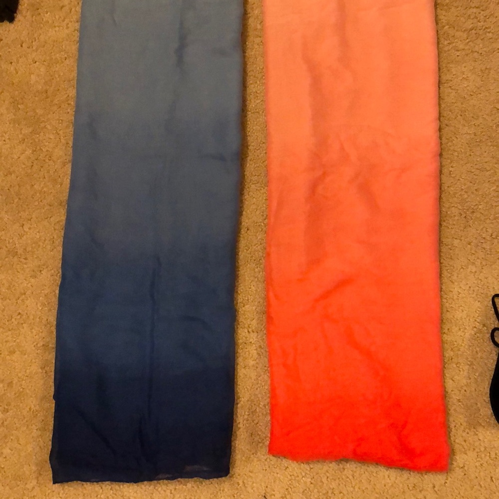 Two ombré infinity scarves, one coral and one blue